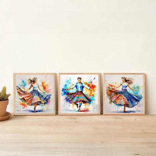 three framed paintings of women in colorful, flowing dresses, arranged on a wooden floor against a white wall.