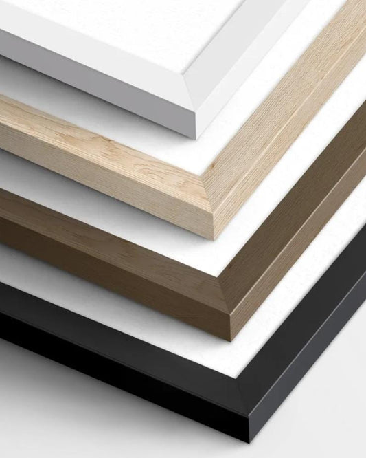 a collection of various colored wooden frames, including white, light brown, dark brown, and black, arranged in a visually appealing manner.