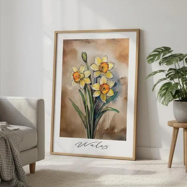 a living room with a gray sofa, a large framed painting of yellow daffodils, a potted plant, and a rug on the floor.