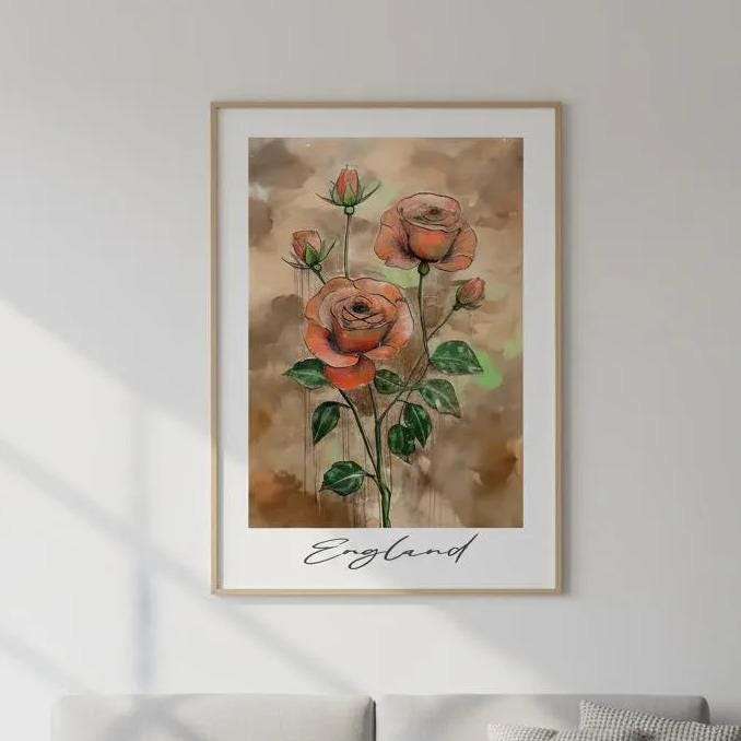 a large framed painting of red roses hanging on a wall above a gray sofa in a living room.